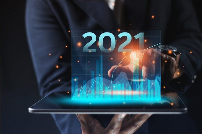 Business people touch graphics technology To analyze the income of the organization Through the laptop of the overall picture of the year Business assessment ideas in 2021 Las tendencias que marcarán la economía en 2021 y próximos años